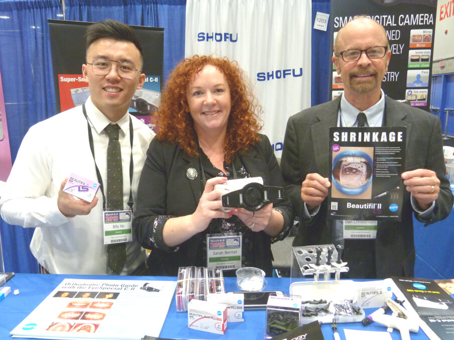 From left in the Shofu Dental Corp. booth: Billy Ho, Sarah Bermel and Dan Christensen with just a few of the company’s many products.