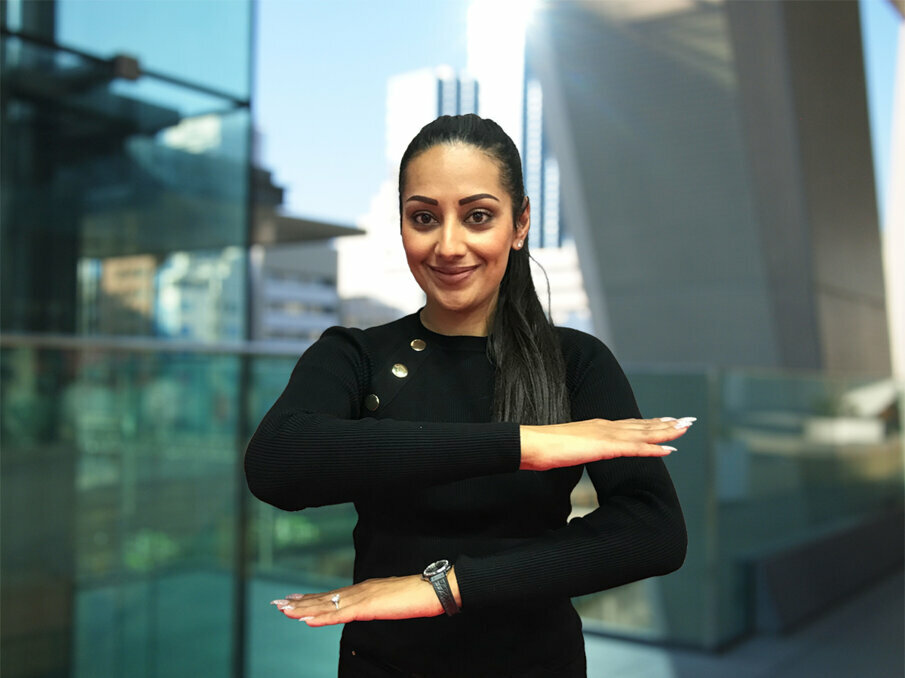 Dentsply Sirona employee, Harpreet Atwal showing the motto of this year’s International Women’s Day #EachforEqual