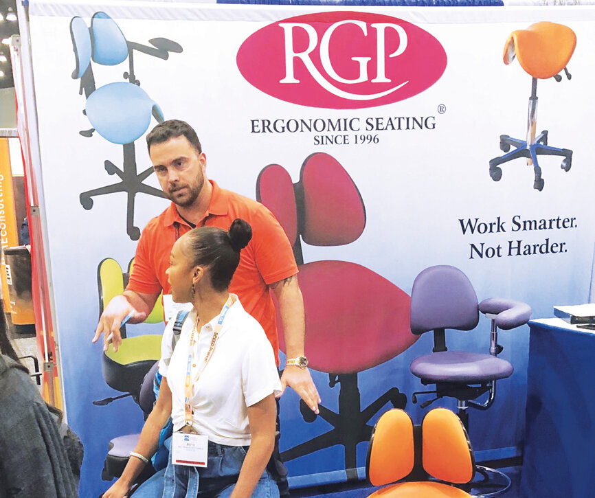 Jason DeCosta of RGP helps a customer with ergonomically designed seating.